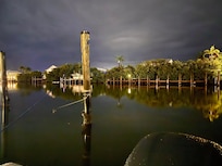 Night photo of the boat slip and canal.