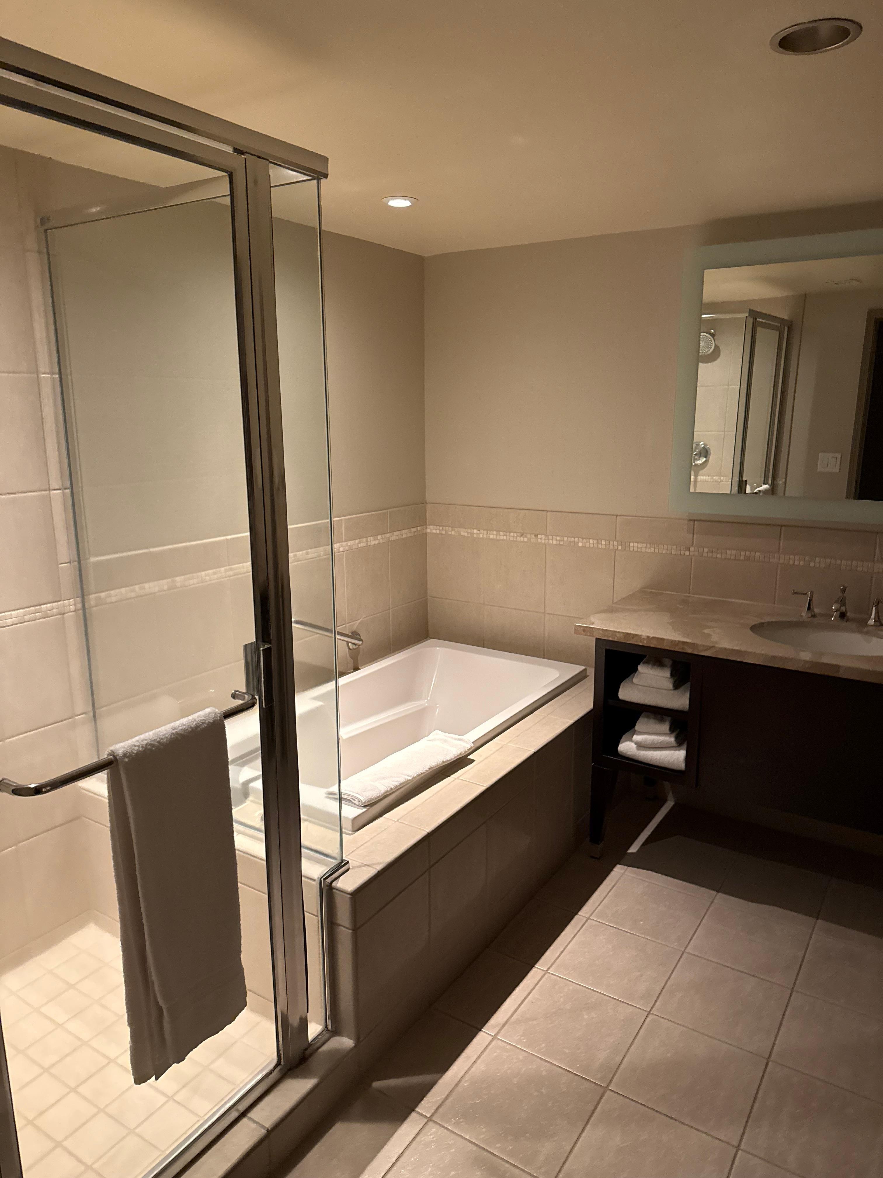 The separation of both shower and tub along with a separate door for the toilet brought space and peace to us both