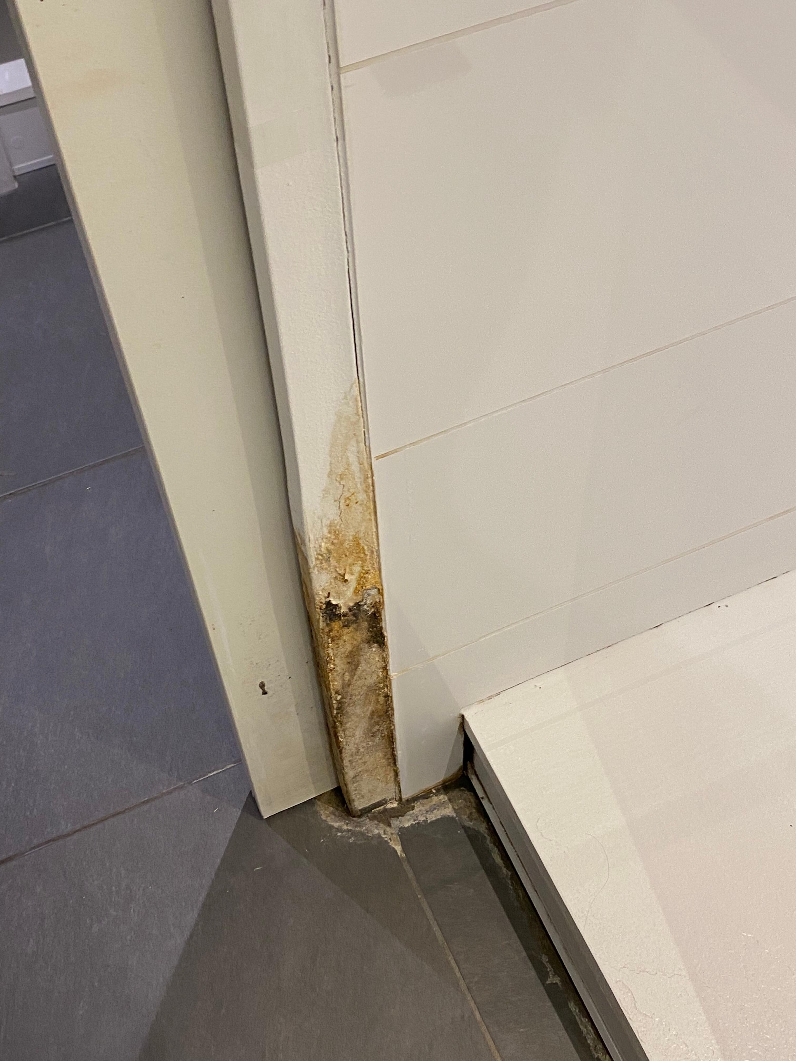 Bathroom water damage on the doorframe