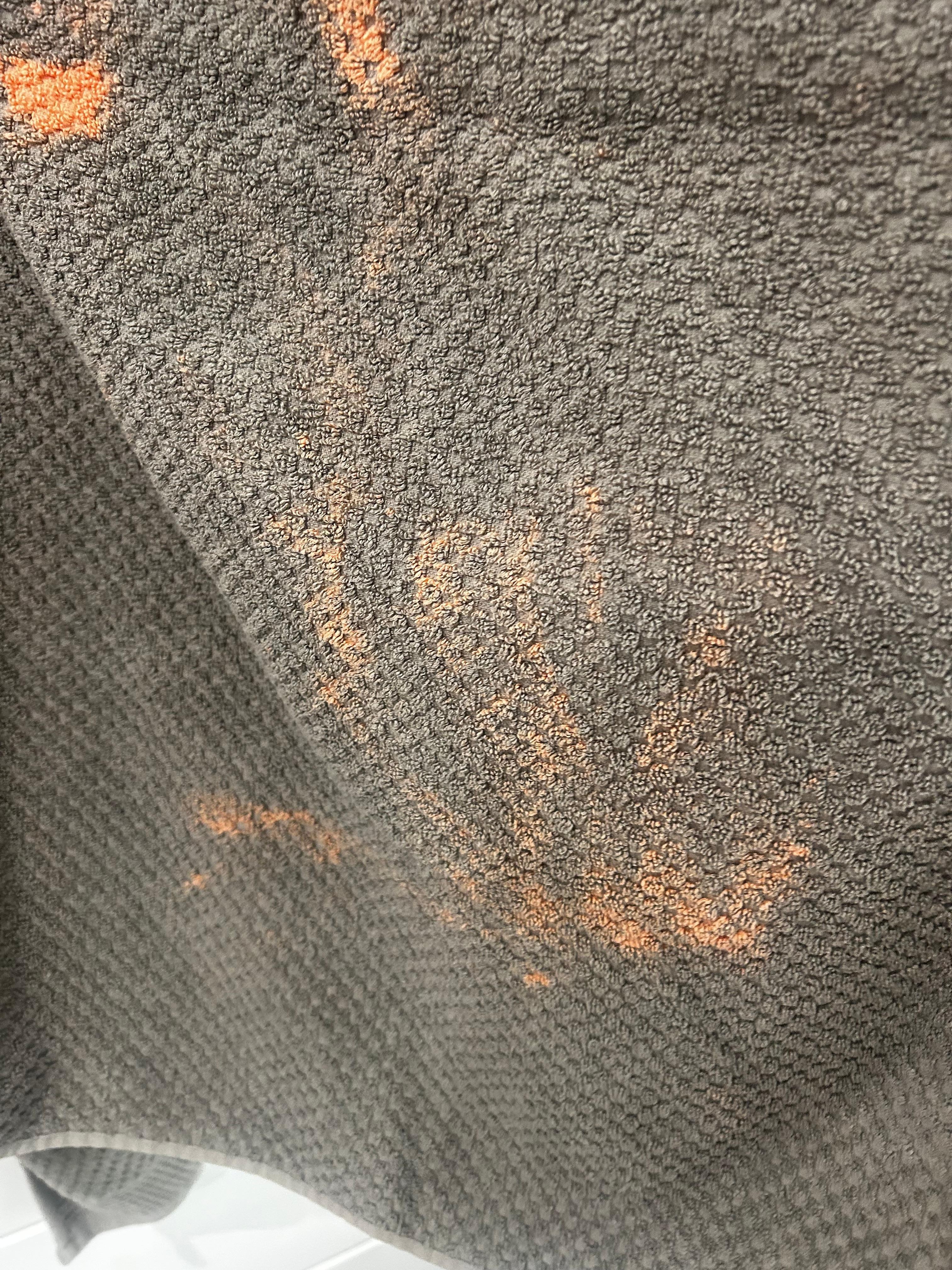 Outdated bath towels that had bleach stains 