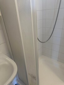 Dirty out dated shower unit