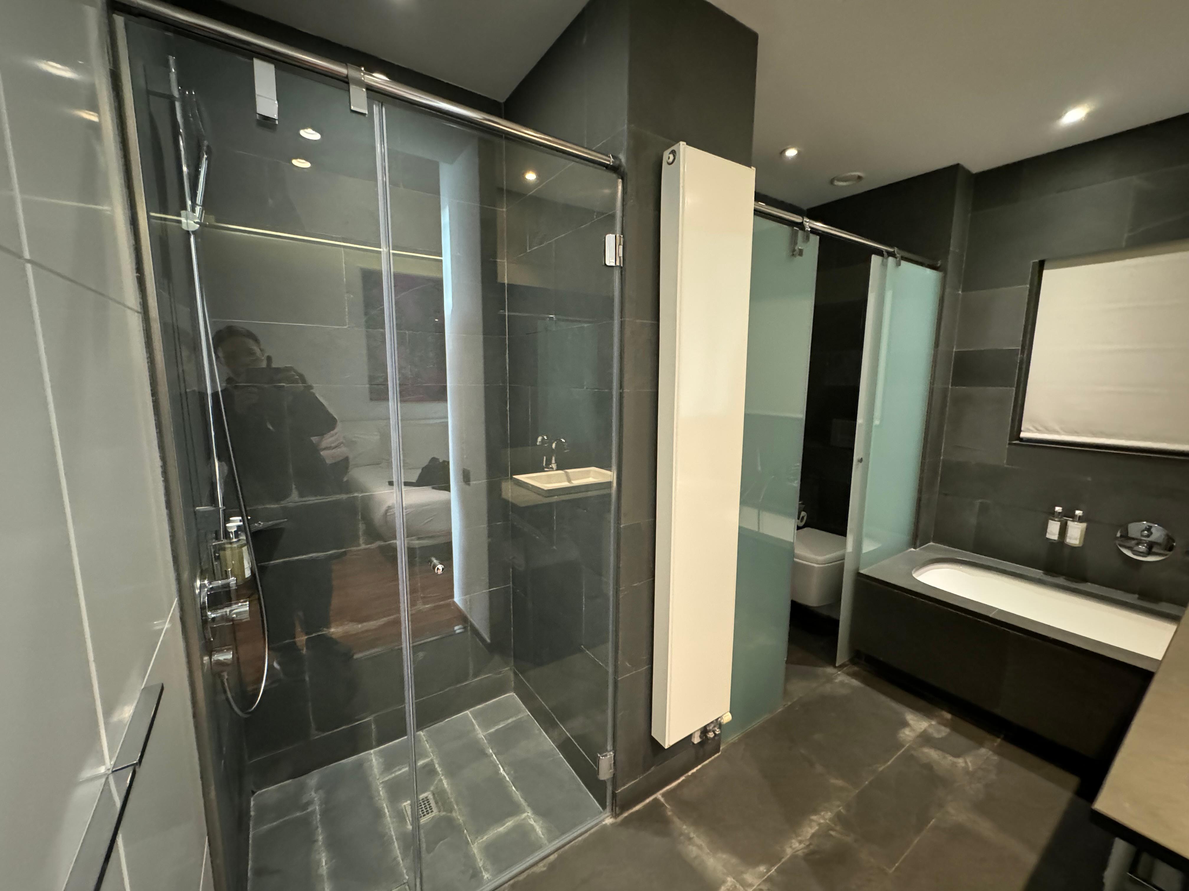 Toilet semi-transparent glass sliding door not up to ceiling. Smell and noise…