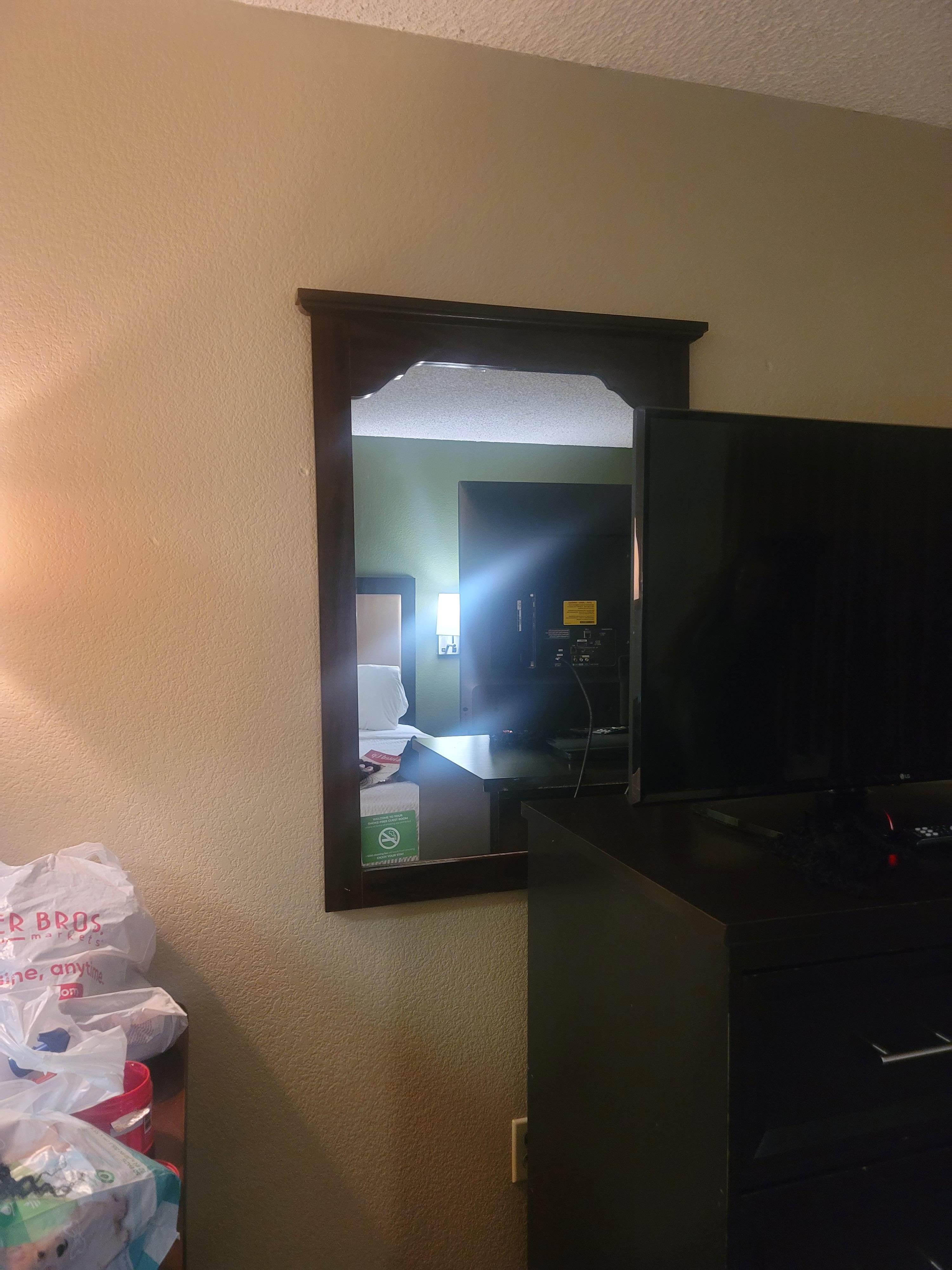 Why but a mirror behind the TV 