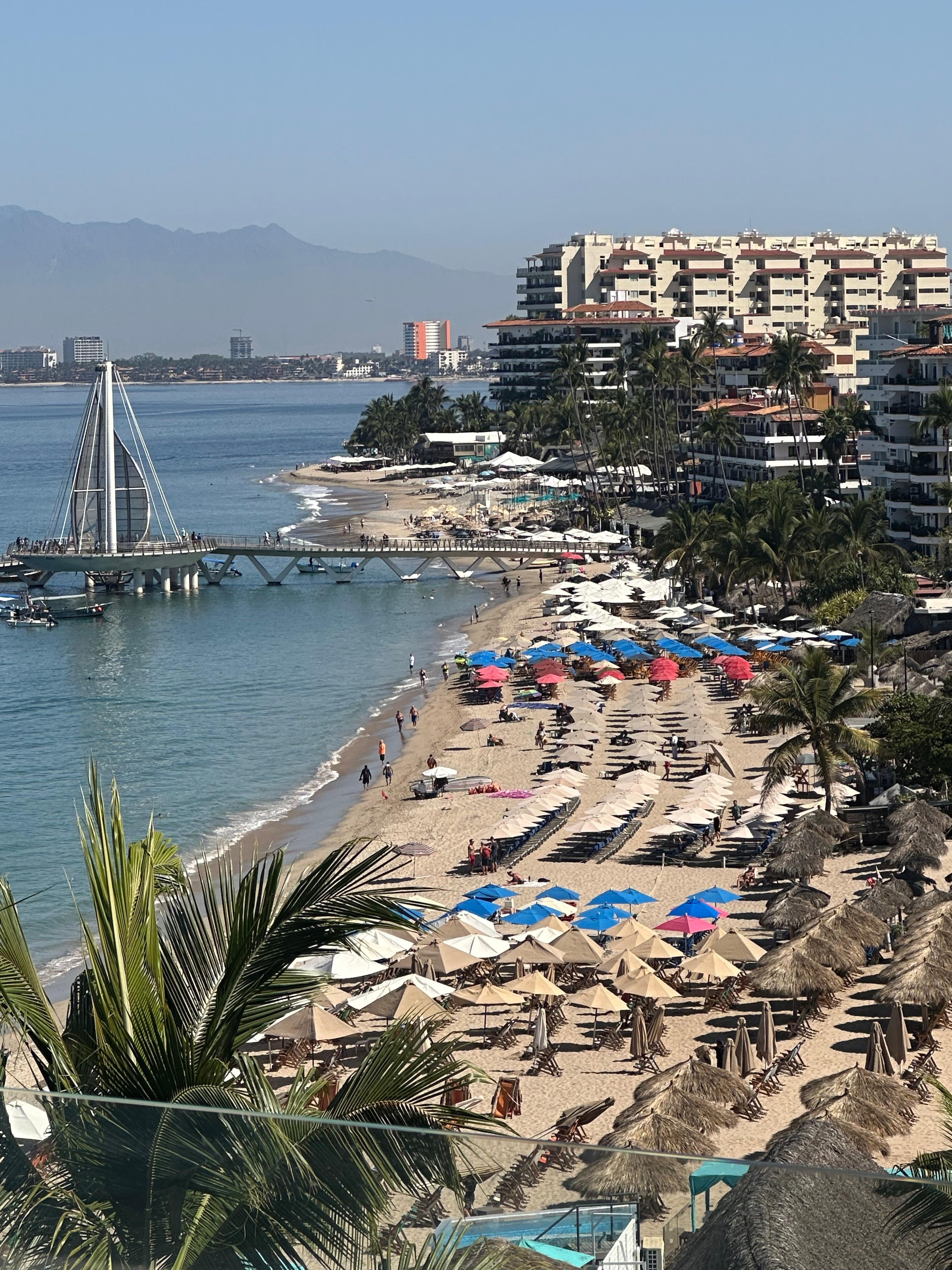 View of beach from condo balcony.