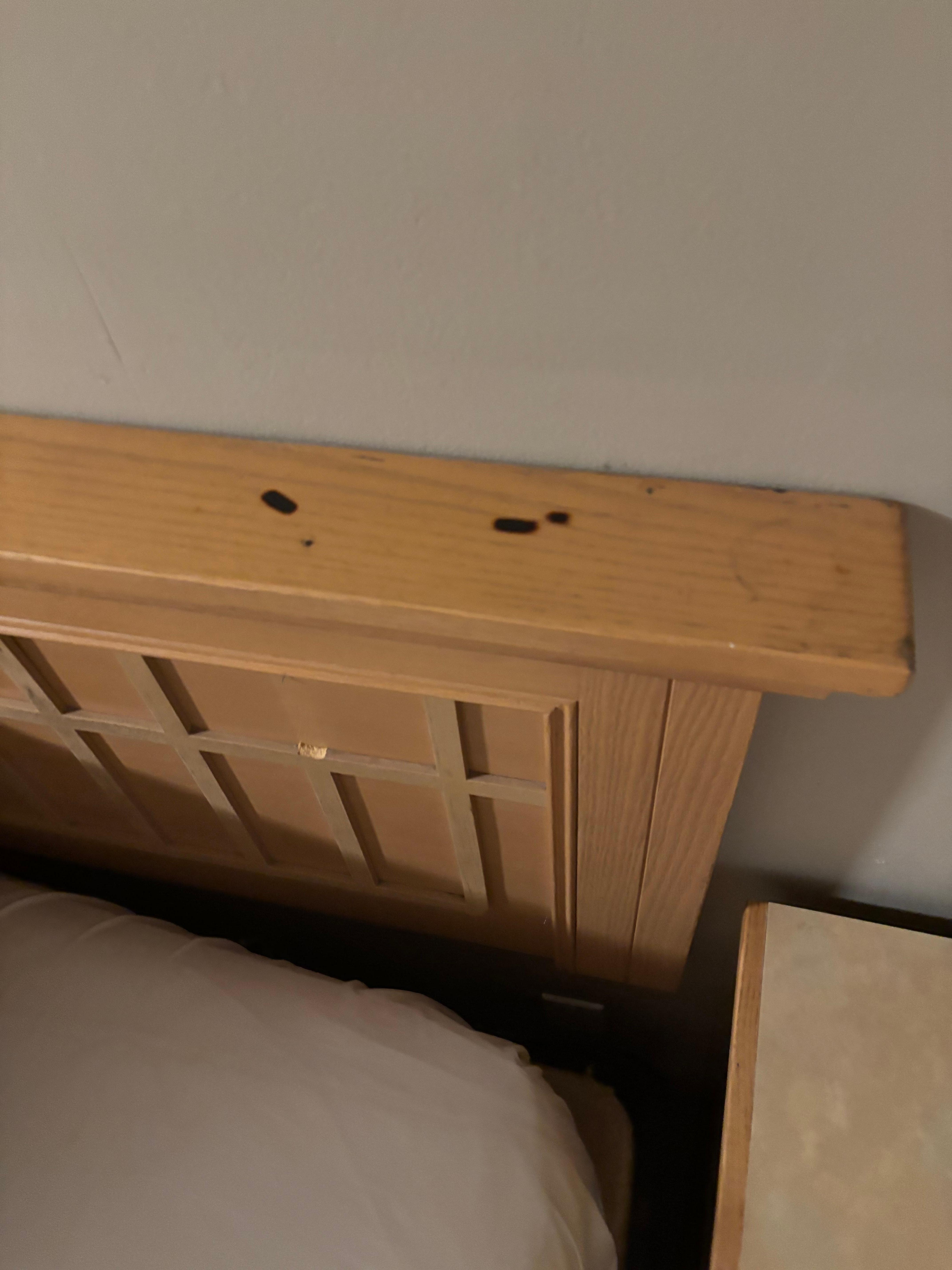 Cigarette burns on headboard