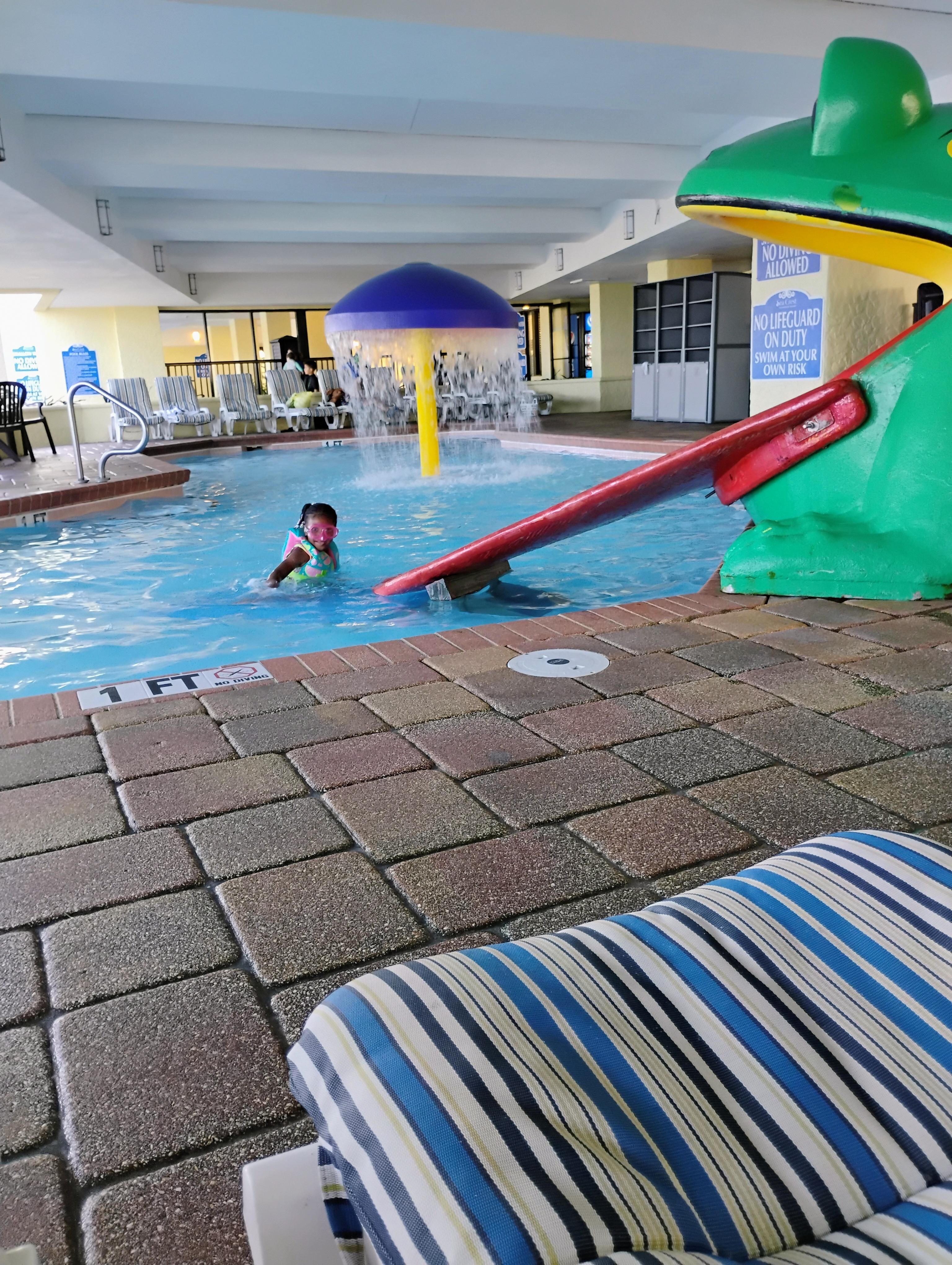 Indoor Frog slide one foot pool area