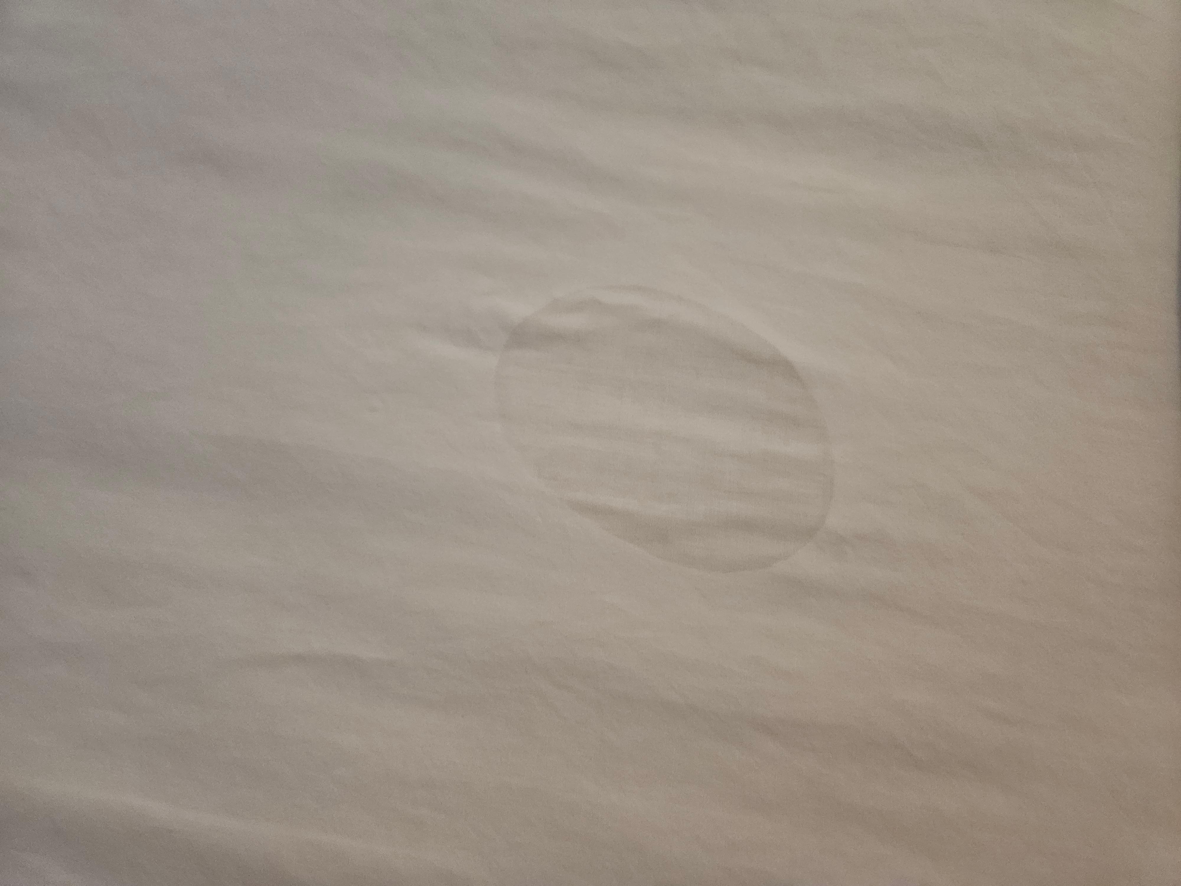 Stain on bedsheet.