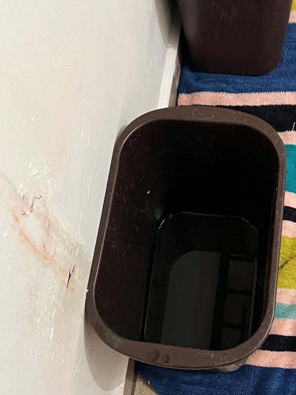 Garbage cans with water from AC Units