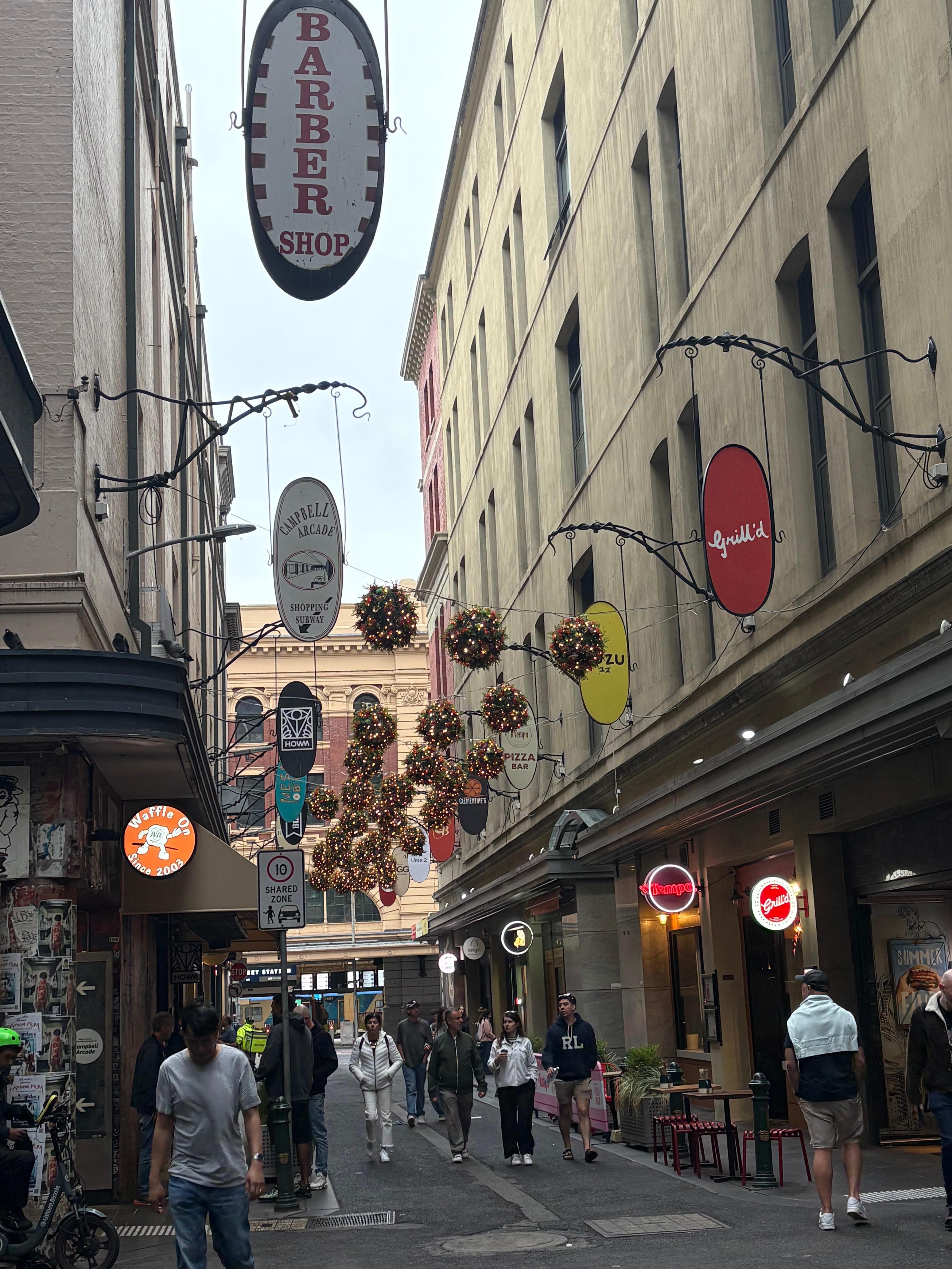 The street below the apartment with the busy cafes and restaurants below.