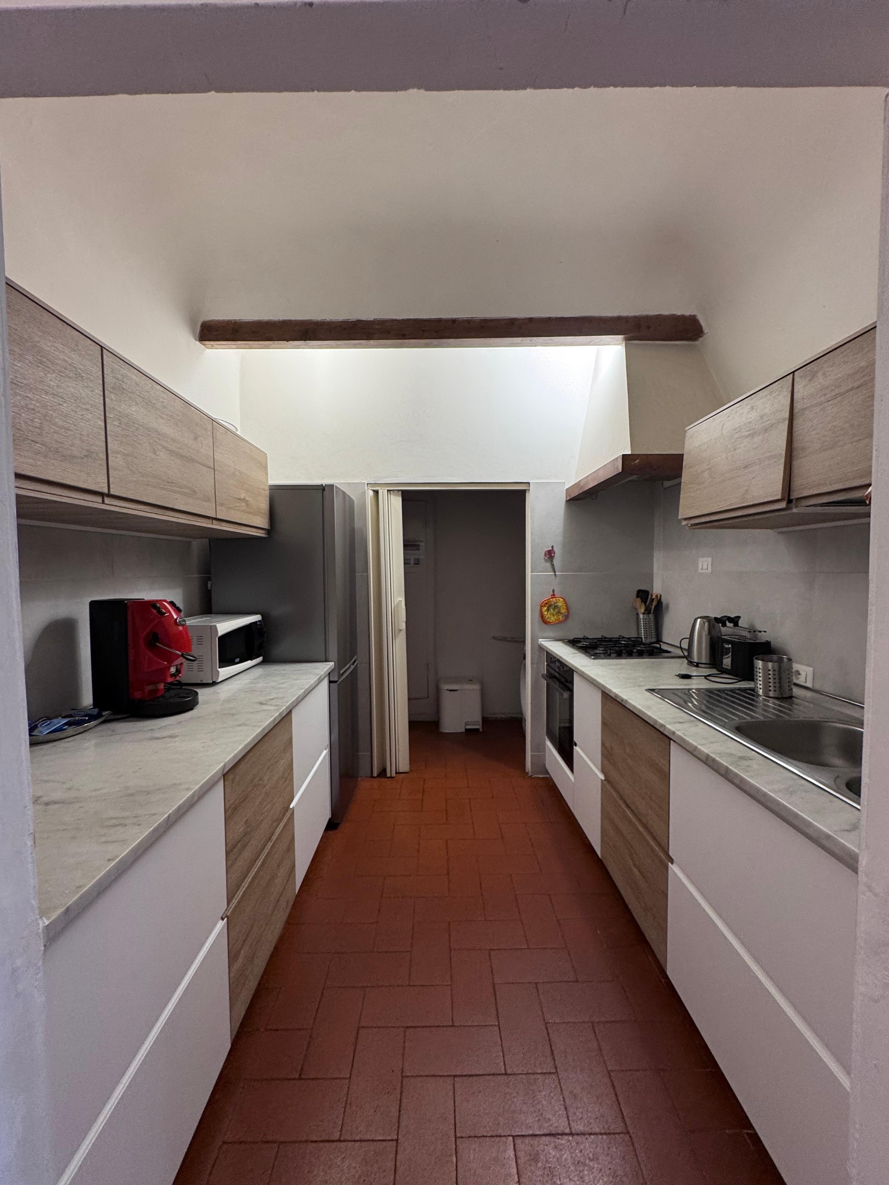 Kitchen with washing machine in back)