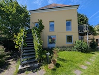 Apartment accessed by the external staircase on the left