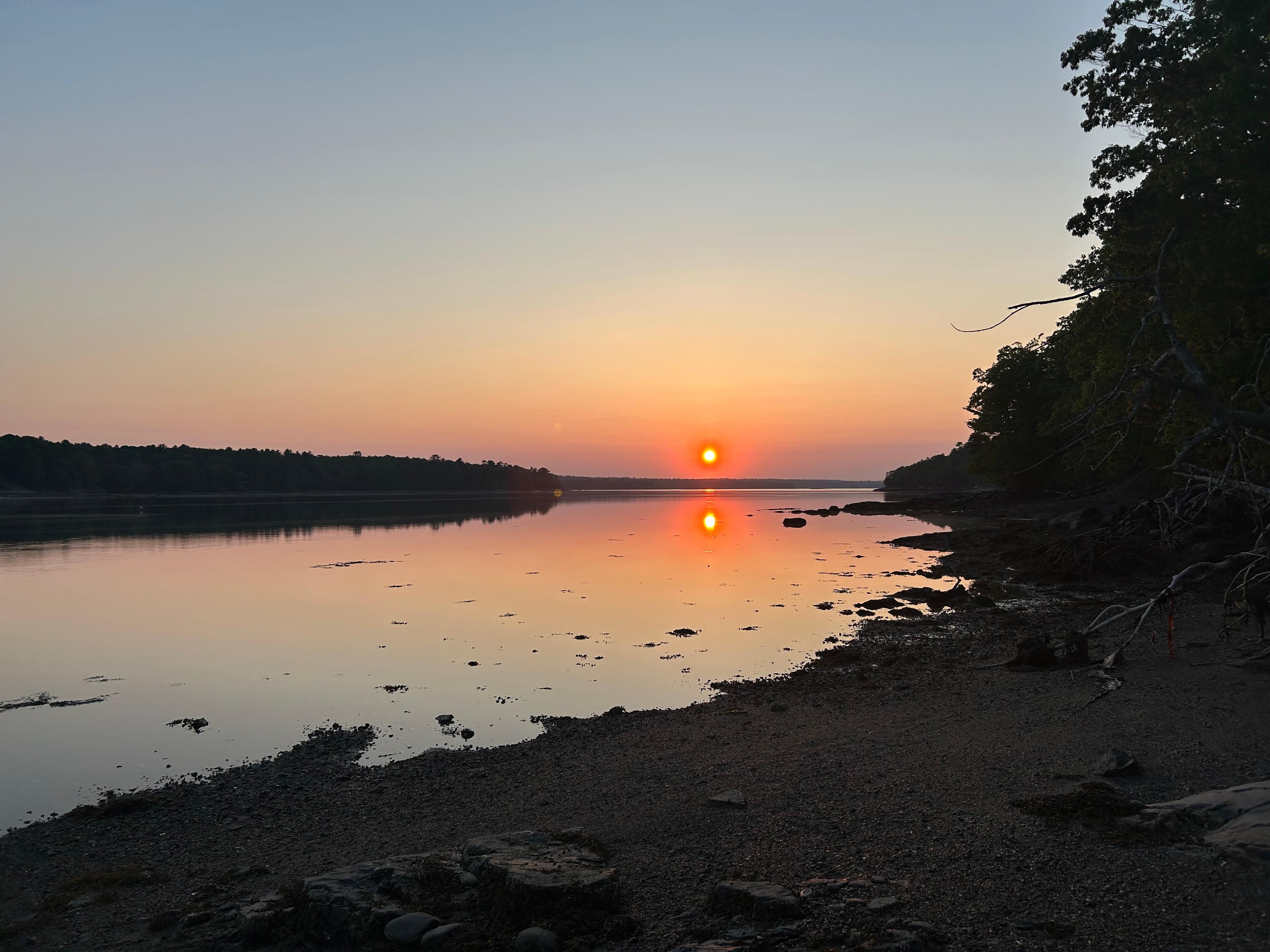 Sunset by the water
