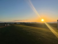 A view from the rear yard, looking over the water.