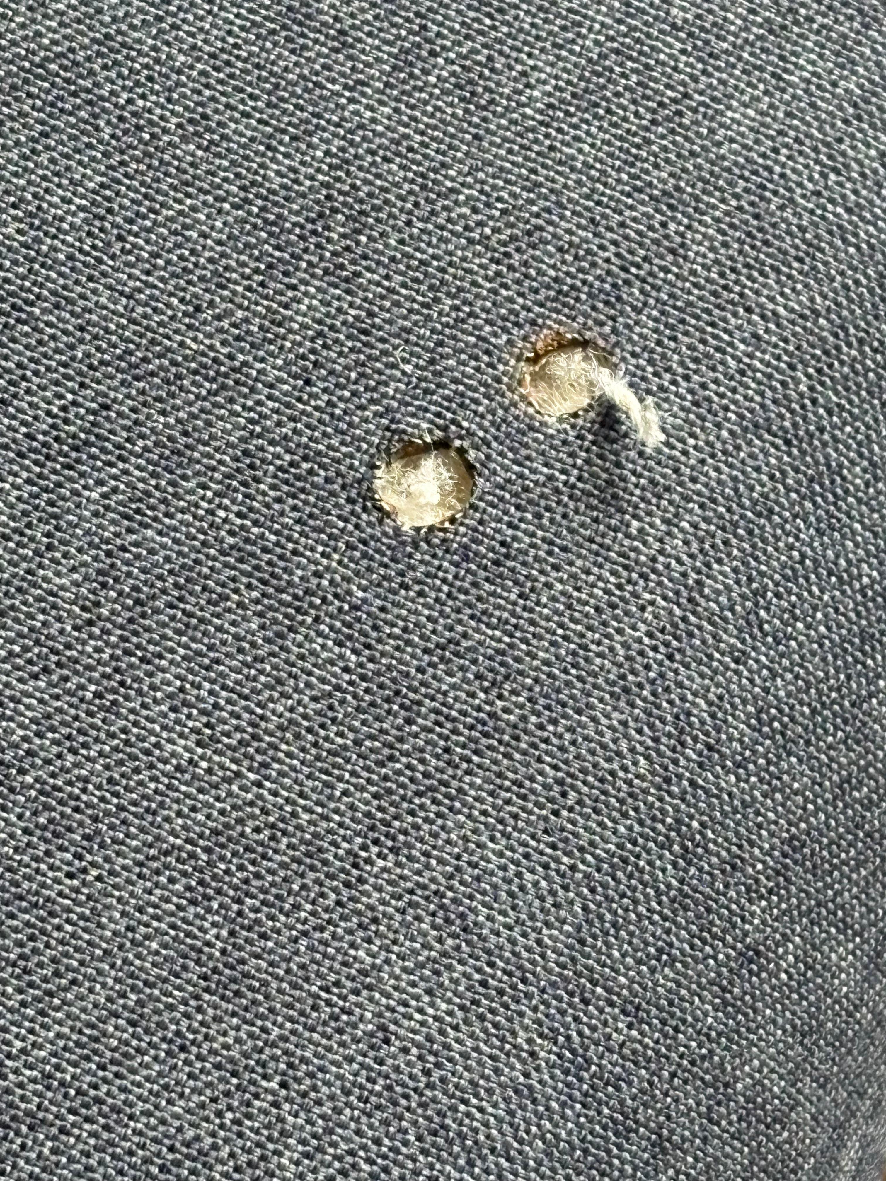Cigarette holes in the couch