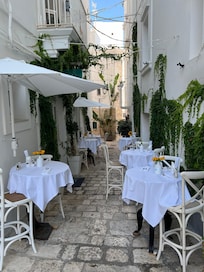 Wonderful alfresco early morning breakfast in a charming street.