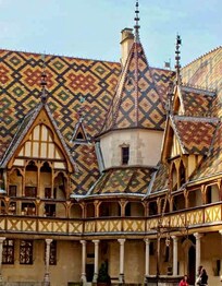 The Hospices de Beaune or Hôtel-Dieu de Beaune is a former charitable almshouse in Beaune, France. It was founded in 1443