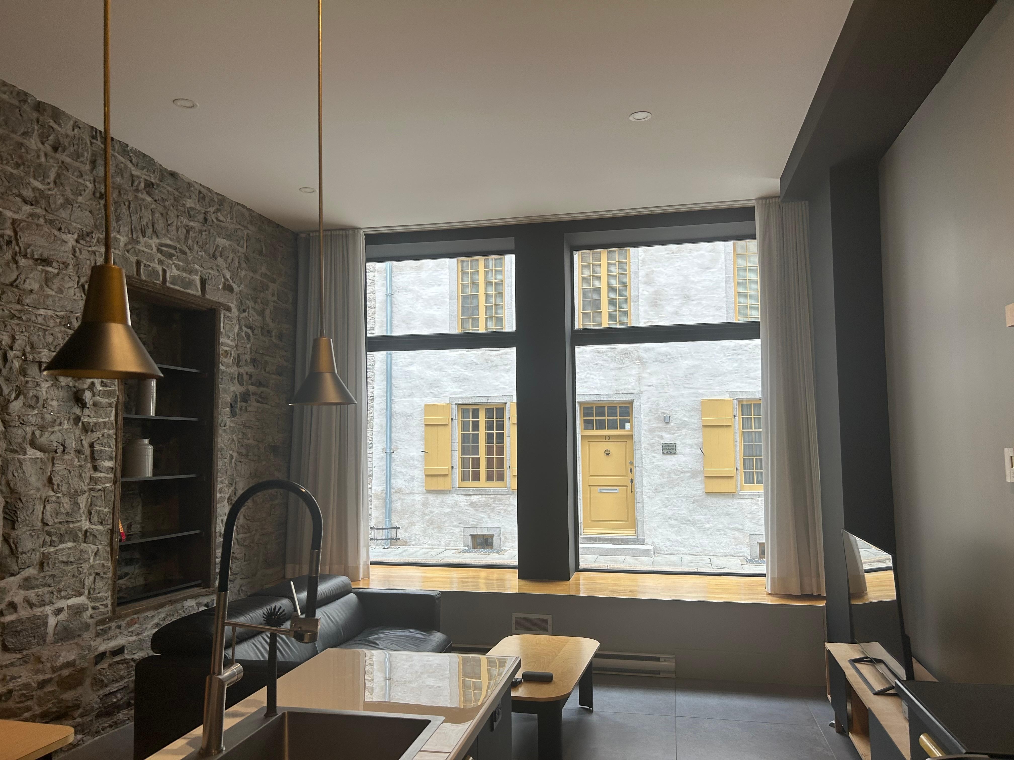 Unique apartment with large street side windows.