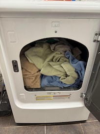 Sheets and towels in dryer.