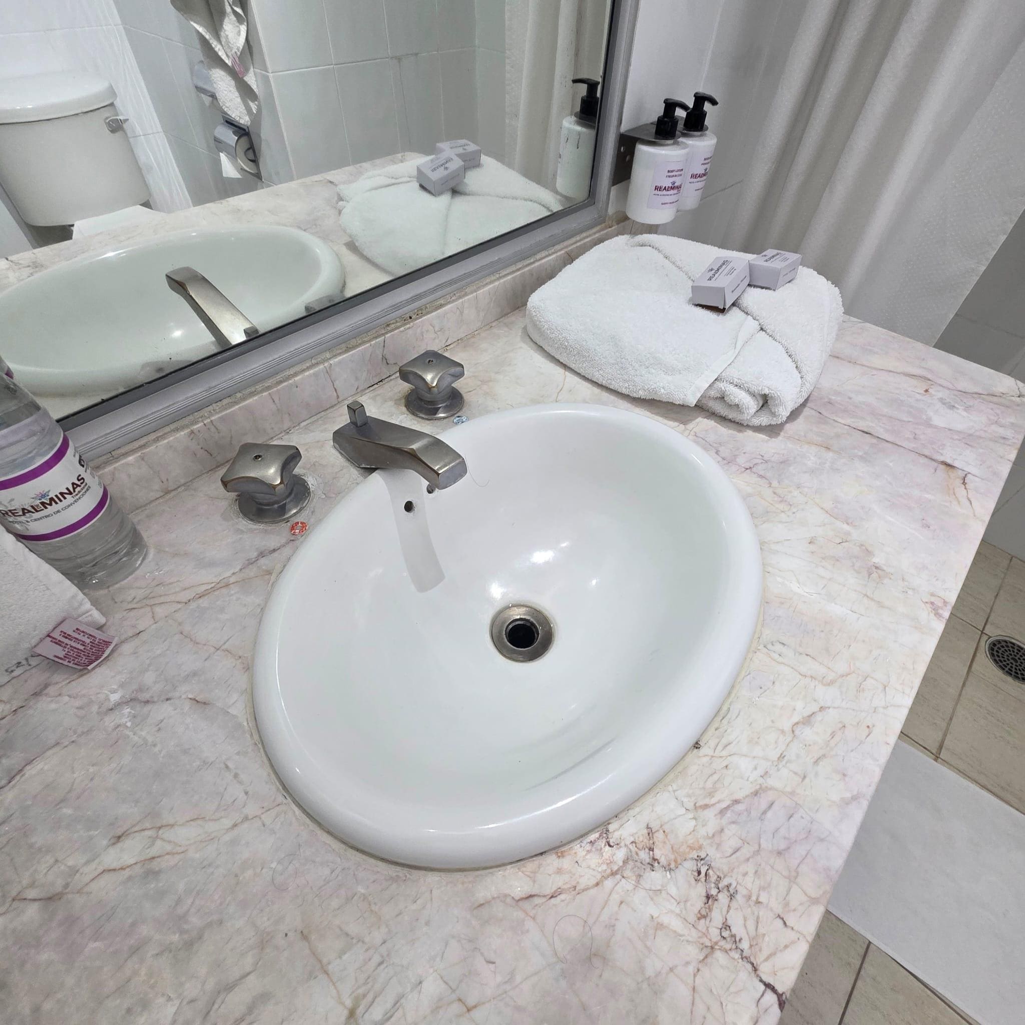 Dated faucet and sink.