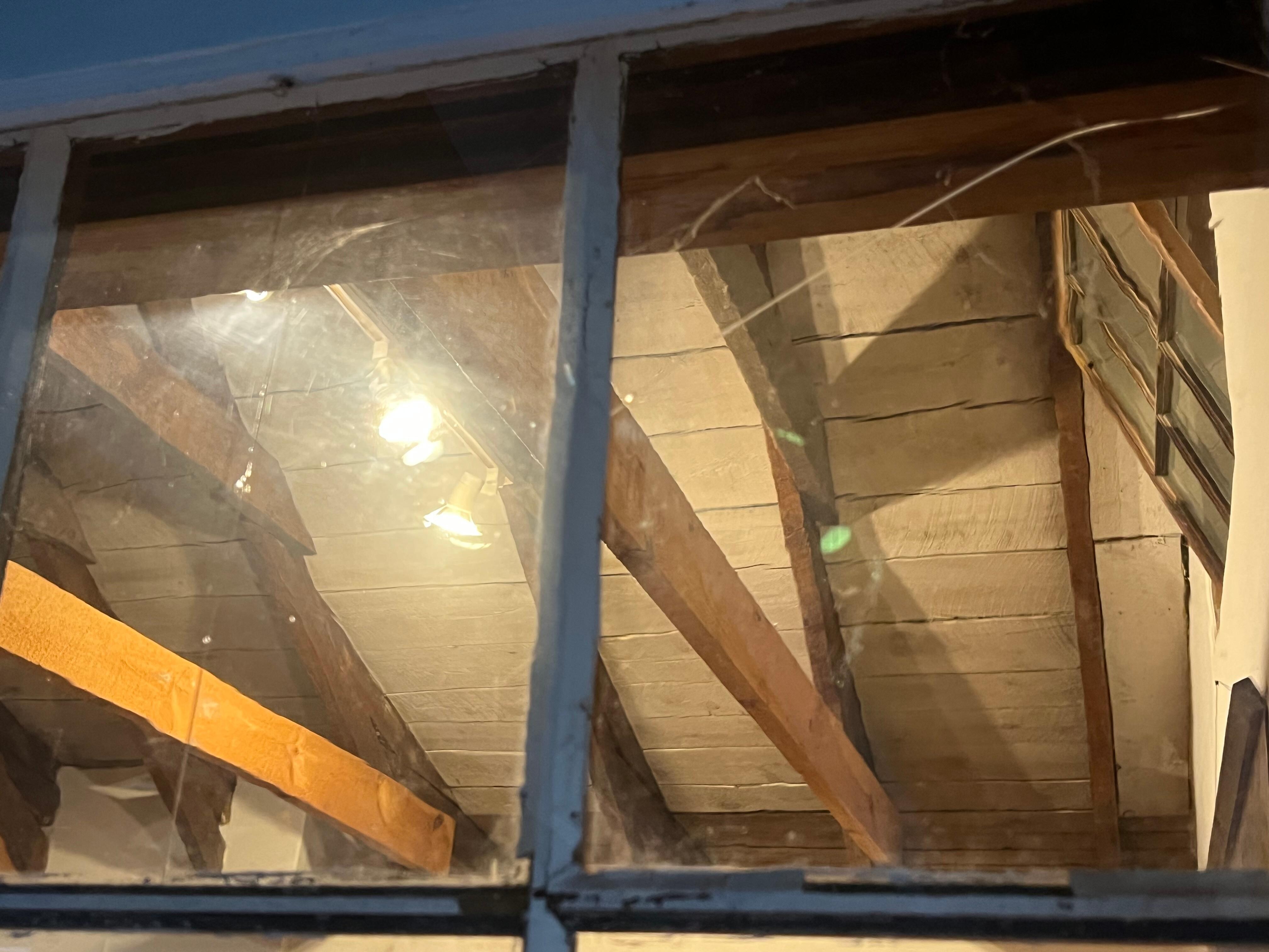 One of several broken panes in the windows