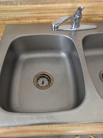 There was a small hole in the sink next to the drain hole. The spout for filtered water at the end of the sink was not even hooked up.
