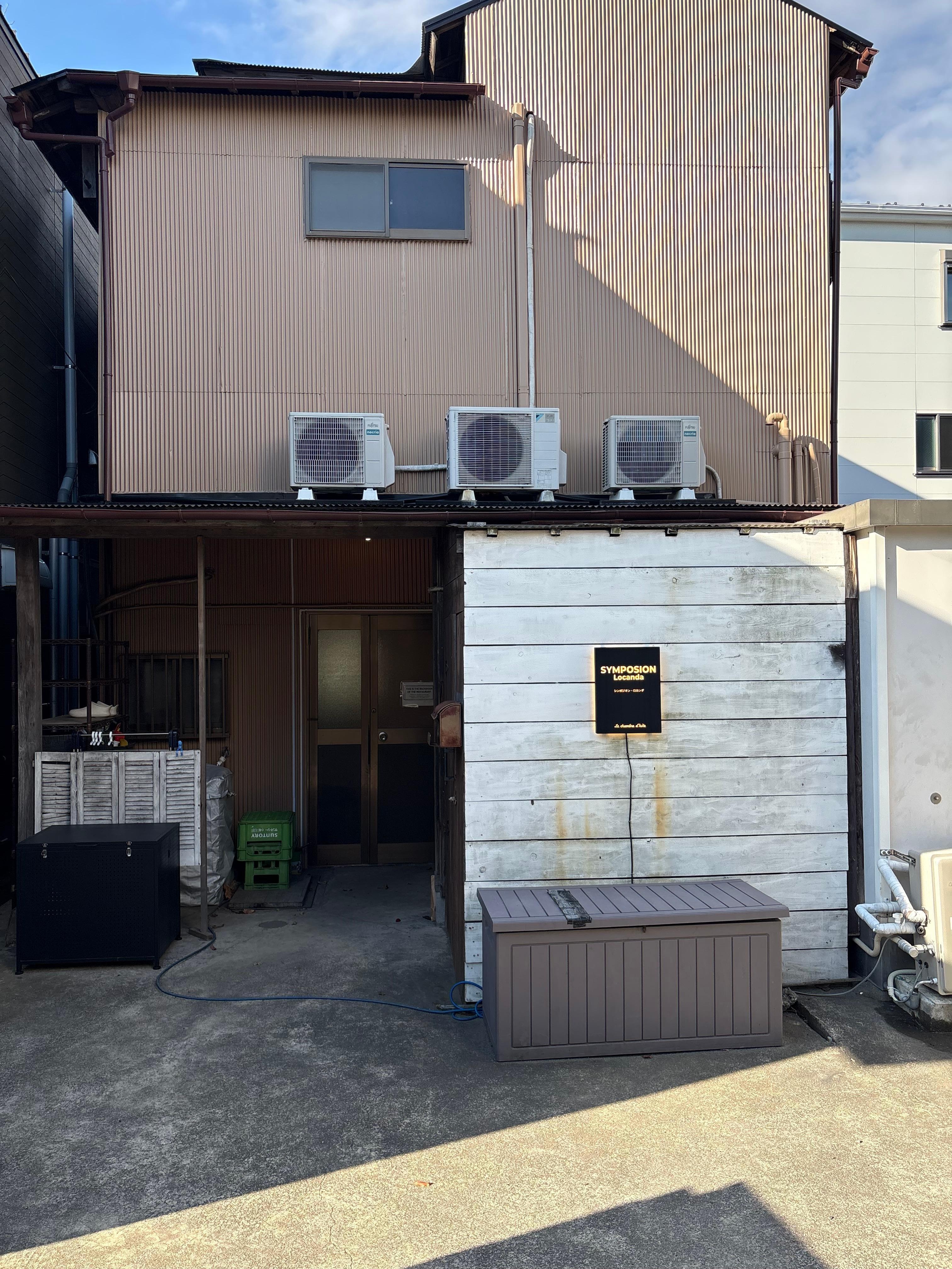 Front of hotel but can NOT be seen front street. It is the backside of building