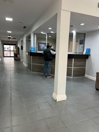 Depressing gray lobby with bullet proof glass