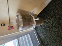 Trash can at the end of the hallway was filthy.