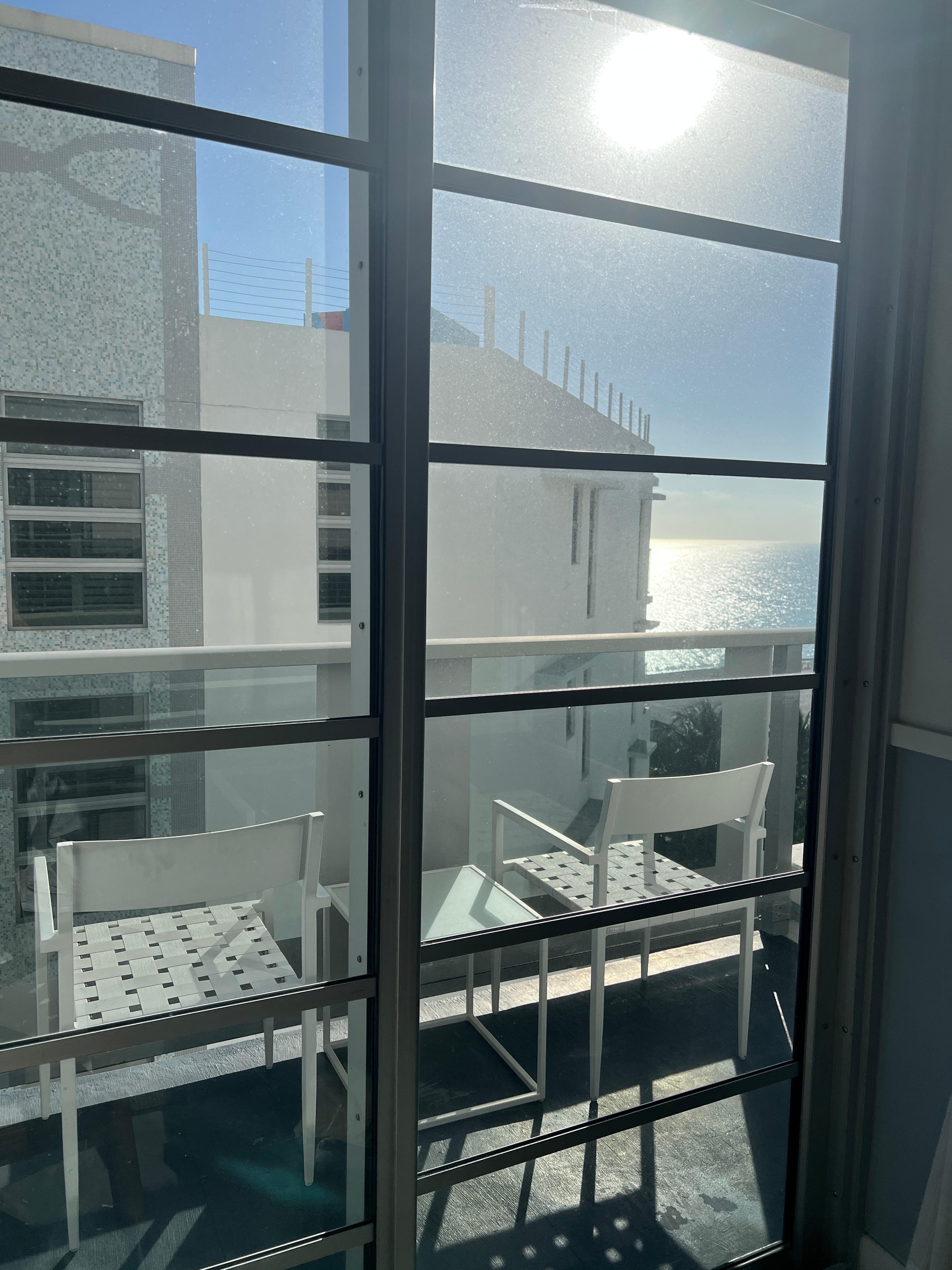 If you stood in one corner of the room, you could see just a bit of ocean around the side of the building in front