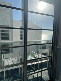 If you stood in one corner of the room, you could see just a bit of ocean around the side of the building in front