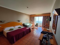 Quarto com varanda vista mar