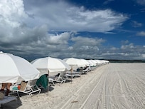 Umbrellas and chairs available no charge, first come