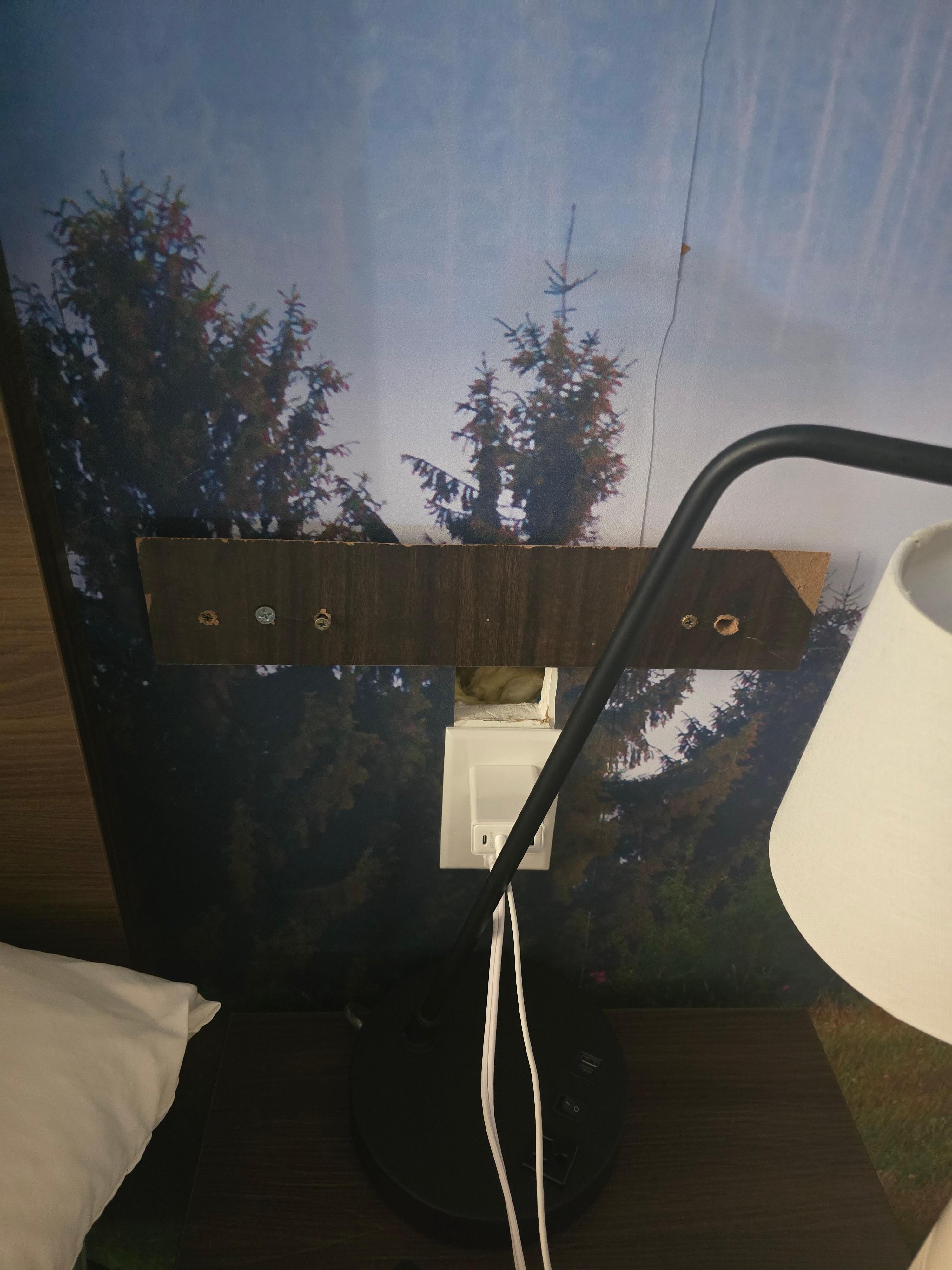 Hole in the wall next to night stand