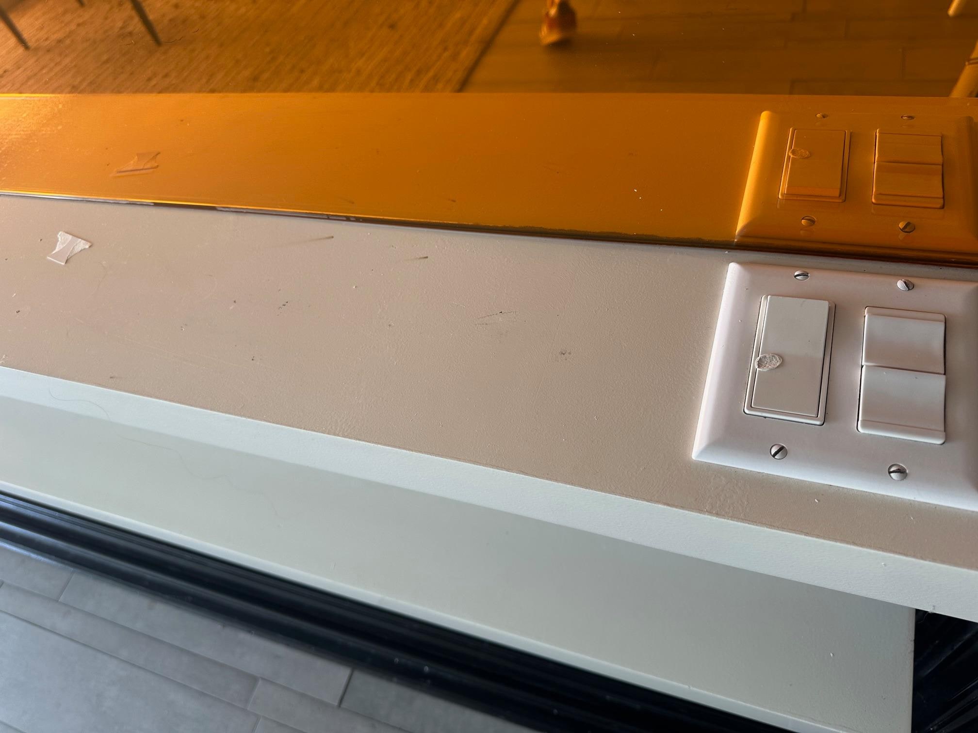 Burn marks all over in the room. Mirror in the background is tinted yellow for some reason