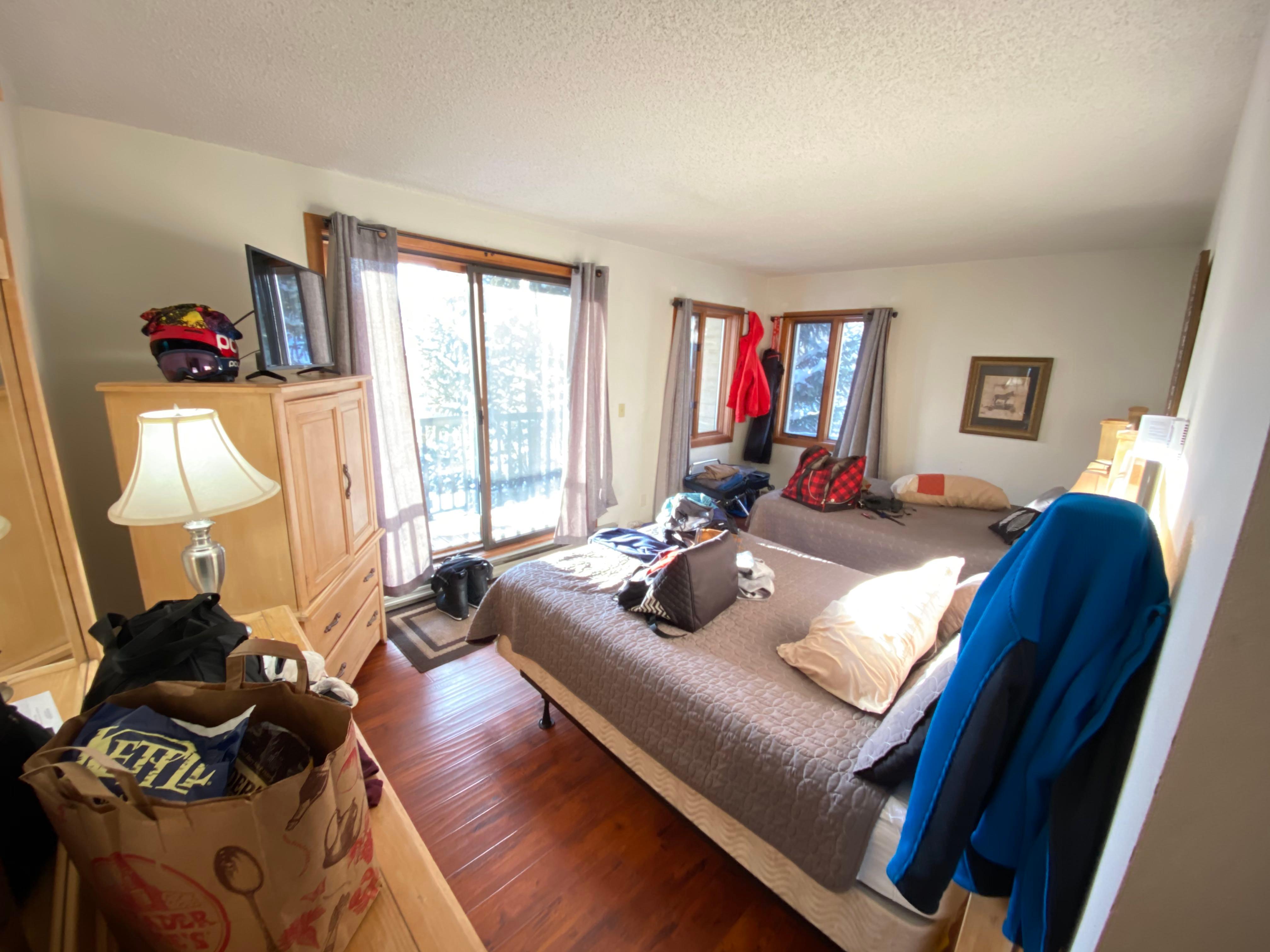 Laminate flooring.  Old squeaky mattresses. There is also a "box" TV inside armoire