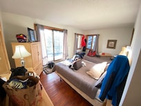 Laminate flooring. Old squeaky mattresses. There is also a "box" TV inside armoire