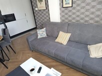 Sofa. Bed. Opens out or it's big enough to sleep if there's just one of you with room to spare. Very comfortable even for a sofa bed.