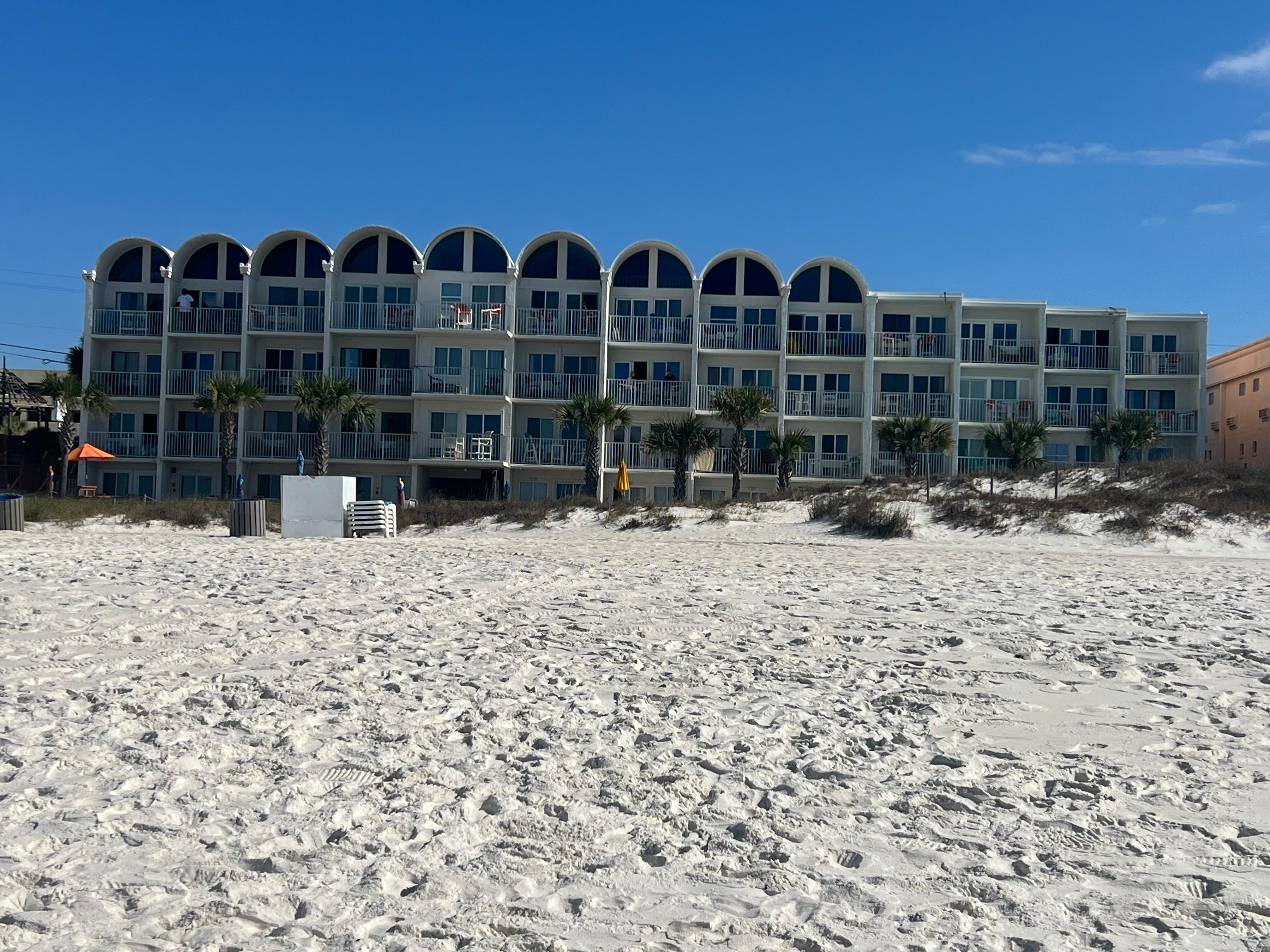 View of our condo from the beach. Center condo on the third floor.