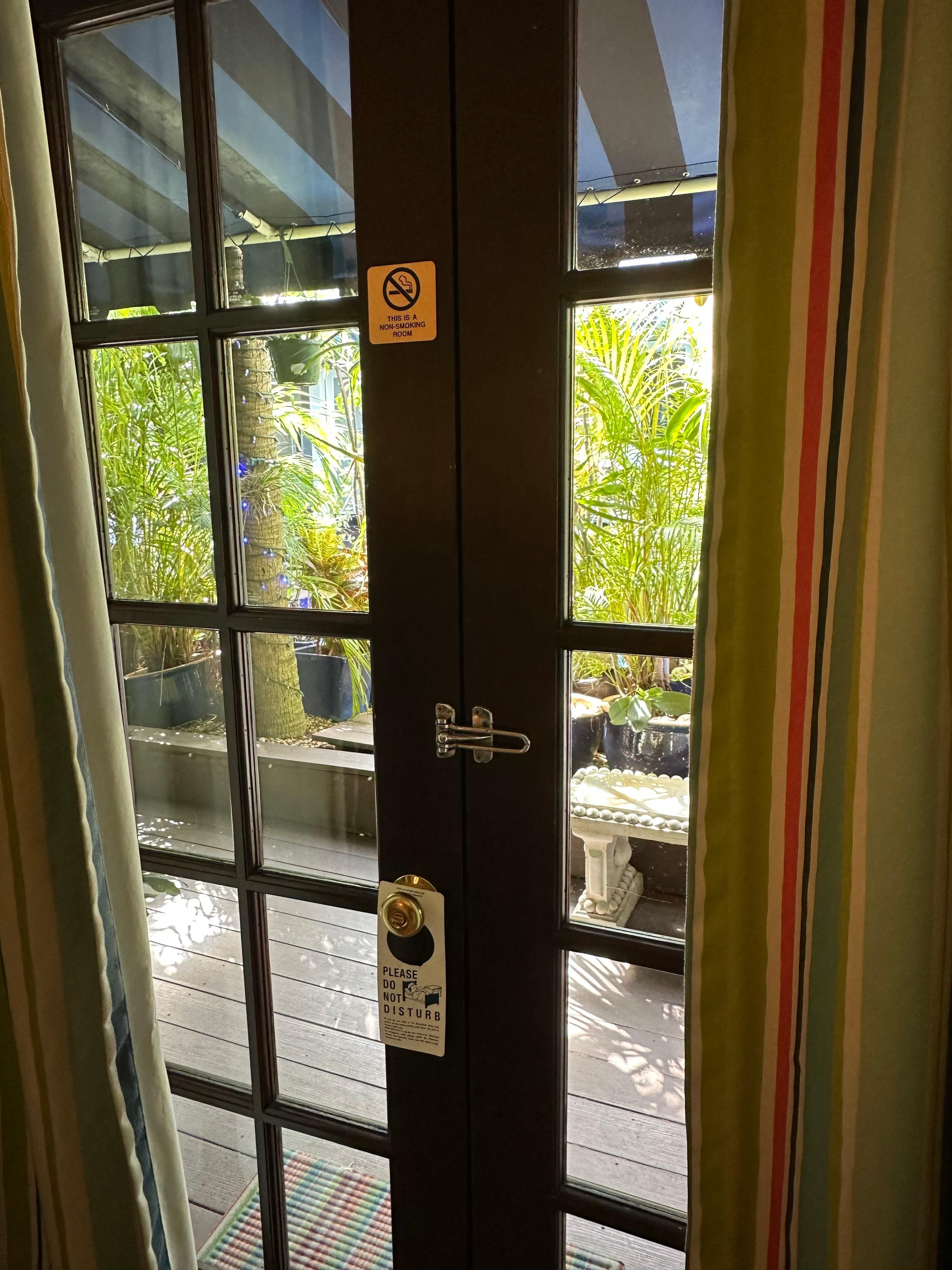 Entry doors to room. Pool is located right in front of room 