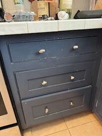 Kitchen cabinets broken/missing paint. Not as shown in listing.