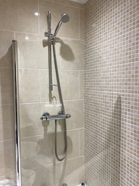 Super sparkly shower. All bathroom fixings were new except for the wood fixings that housed them.