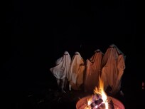 Spooky photoshoot shenanigans around the fire pit.