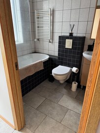 Spacious bathroom with laundry