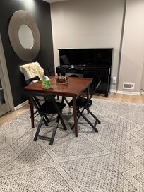 Game table and piano.