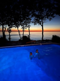 Sunset swims in the heated pool.