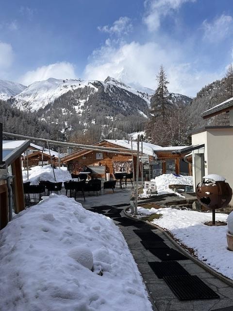 A view looking at the outdoor space and doorway to the spa area