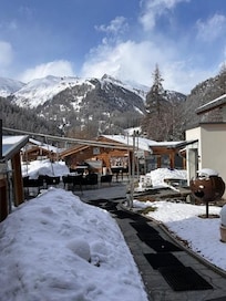 A view looking at the outdoor space and doorway to the spa area