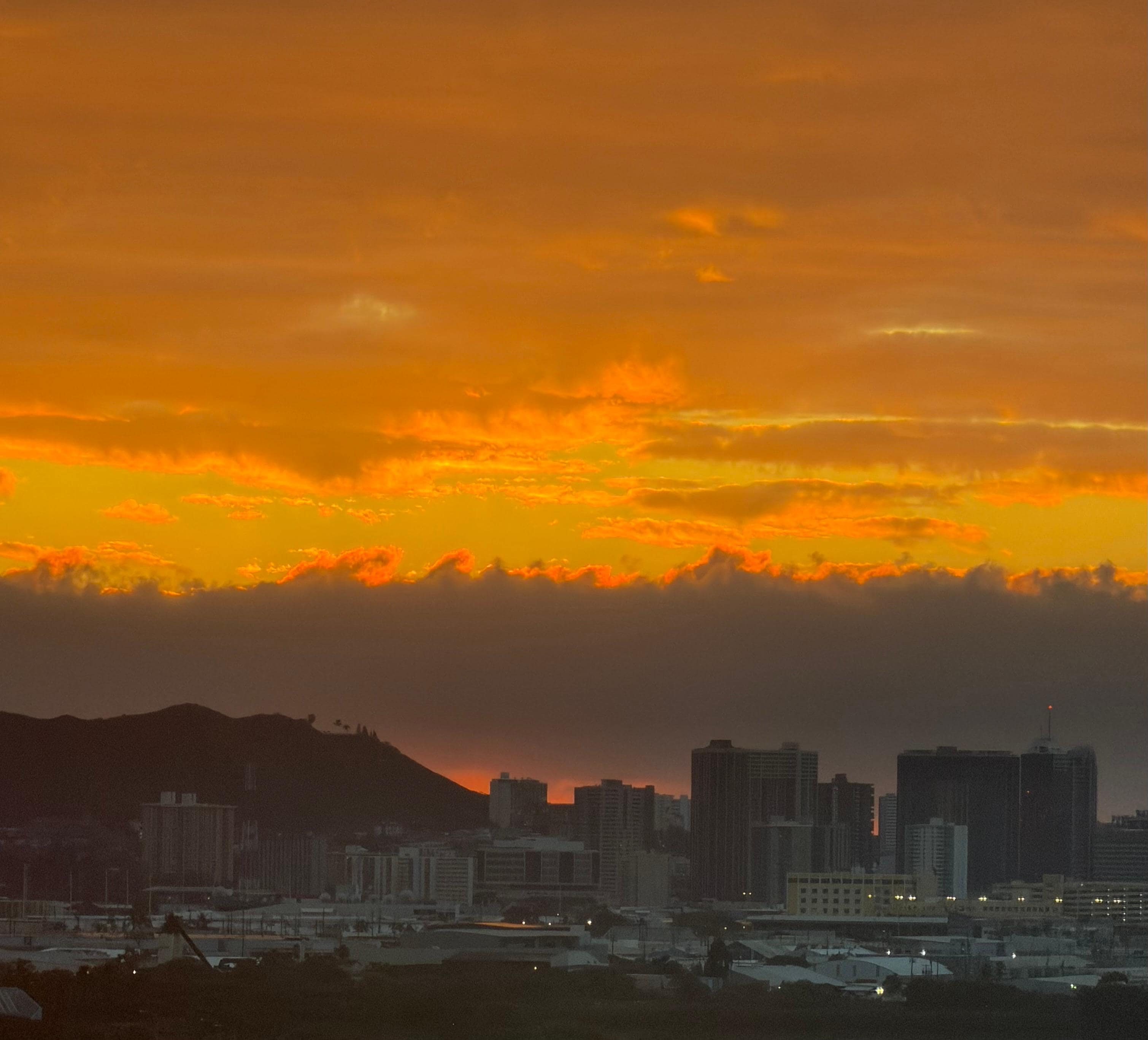 Sunrise over Honolulu from our room 