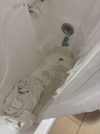 Bath tub coating peeling and clogging drain