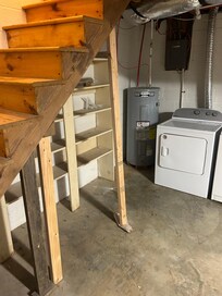 Photo of stairs into basement can not be code compliant…..